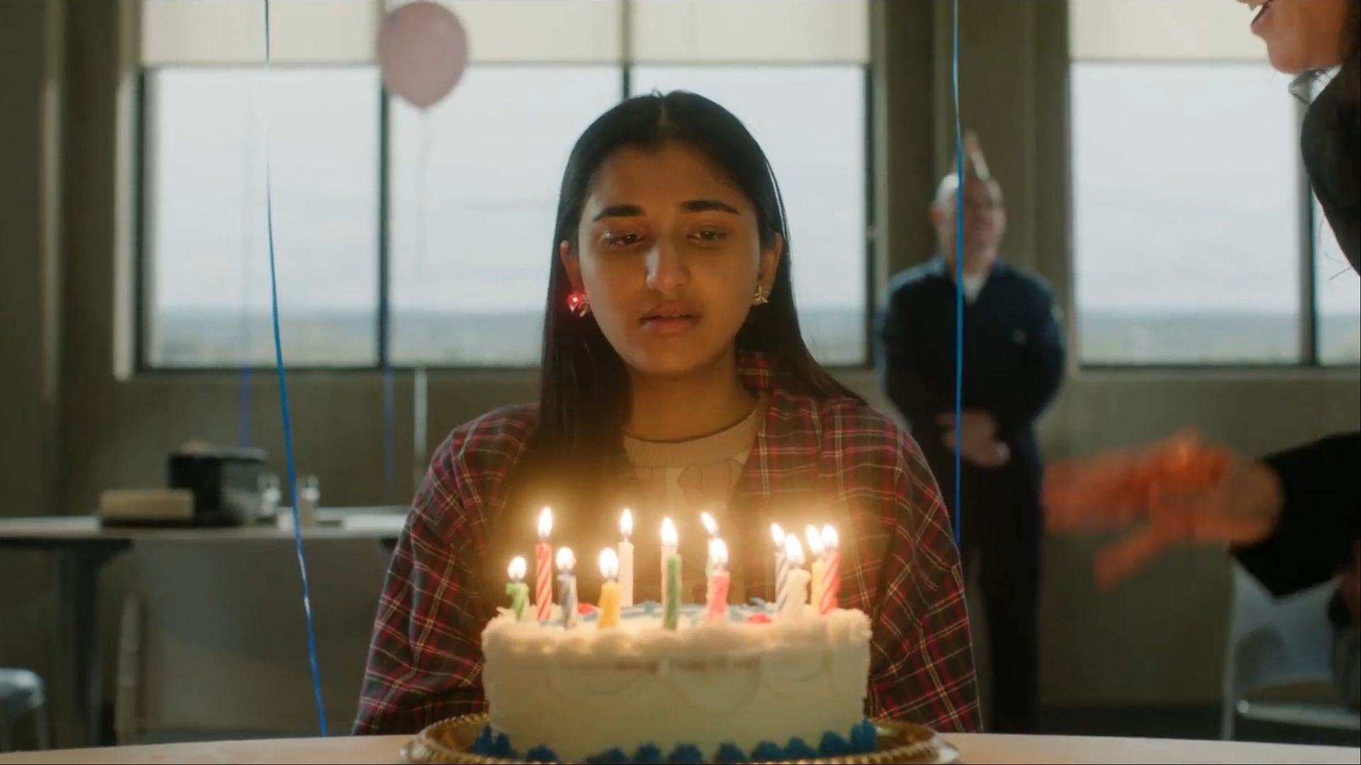Iris during a bittersweet celebration in The Institute season 1 episode 2 as she prepares for her unsettling graduation. (Image via MGM)